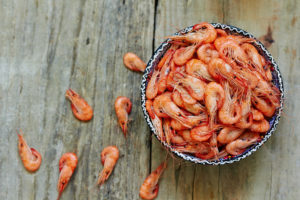 A bowl of boiled shrimp.