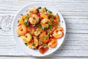 A plate of garlic shrimp.