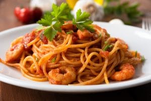 A plate of shrimp and chorizo pasta.