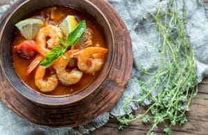 An overhead view of a bowl of shrimp stew