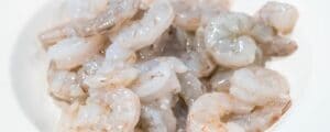 A plate of peeled and deveined shrimp.