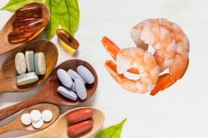 A collection of vitamins alongside shrimp