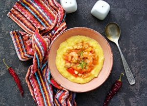 A bowl of spicy shrimp and grits.
