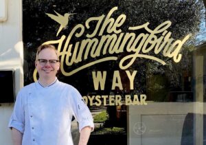 Chef Jim Smith in front of The Hummingbird Way Oyster Bar.