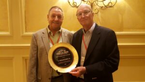Andrew Blanchard, President of the American Shrimp Processors Association and Dr. David Veal, Executive Director accepting the Distinguished Service Award on behalf of Richard Gollott.
