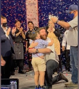 Chef Austin Sumrall being crowned the winner of the 2021 Great American Seafood Cook-Off.