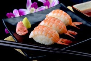 A tray of shrimp sushi.